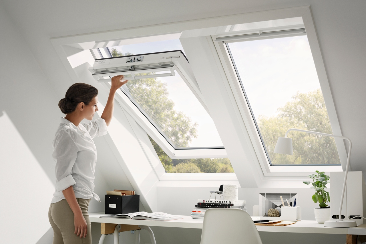 Woman opening roof window