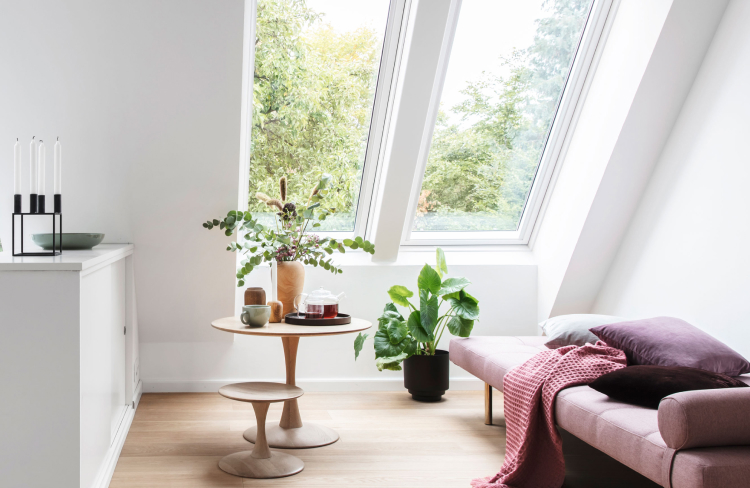 Scandinavian, modern liviing room with two large VELUX roof windows.