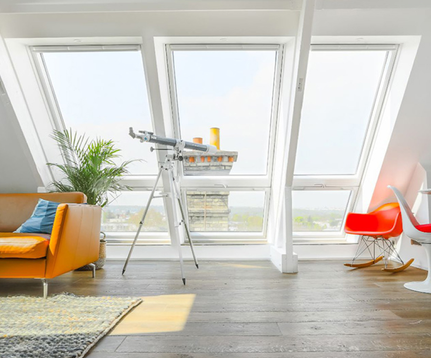 An attic conversion in a penthouse appartment including 3 VELUX CABRIO's.