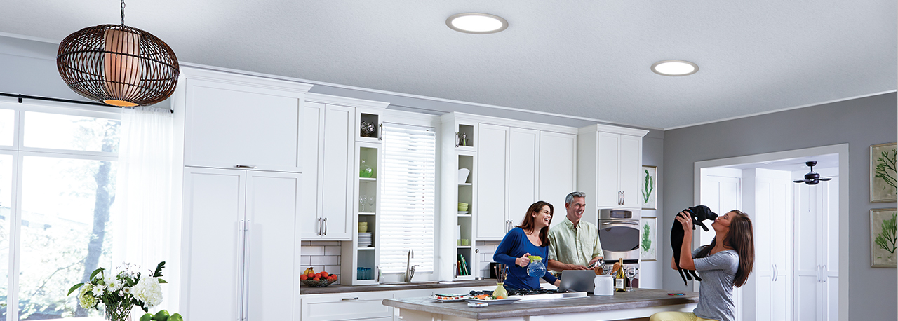 Family in kitchen with SUN TUNNEL