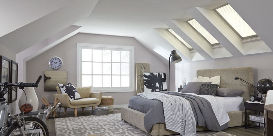 Bedroom with VELUX blinds closed for privacy