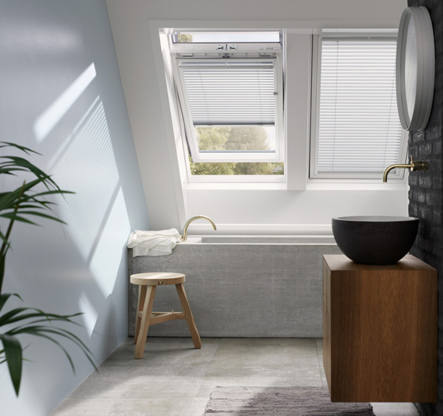 Top hinged roof window installed in bathroom