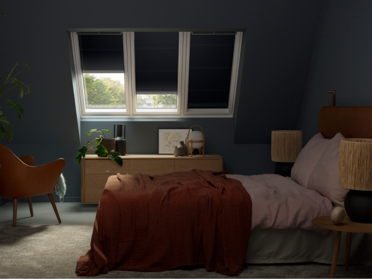 Bedroom with blackout blinds on the VELUX roof windows