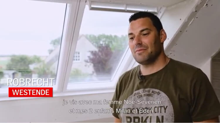 Thumbnal picture of a man standing by the roof window