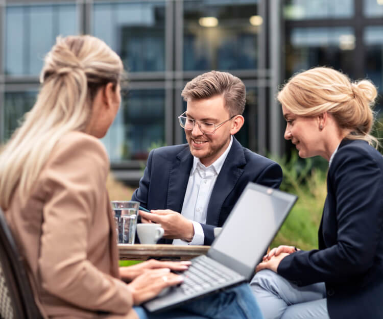 Three people in the meeting outside