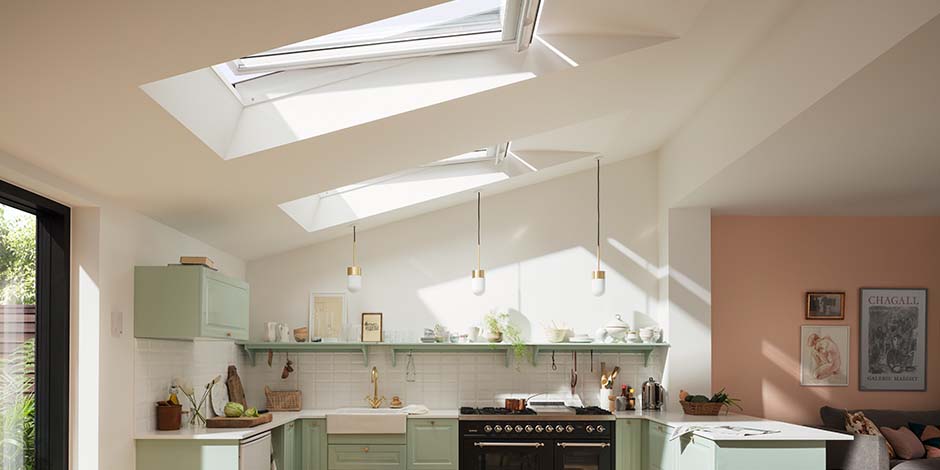 Kitchen illuminated by light from two large VELUX roof windows