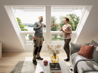 An installer showing the VELUX roof window to the houseowner