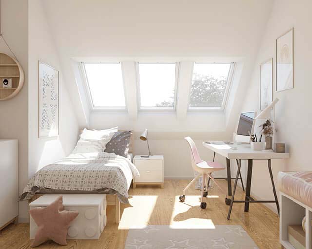 A child's room illuminated by daylight from three VELUX roof windows