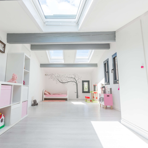 Image of a kid's room with three roof windows