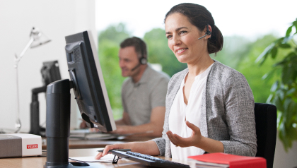 Woman talking on the phone using a headset