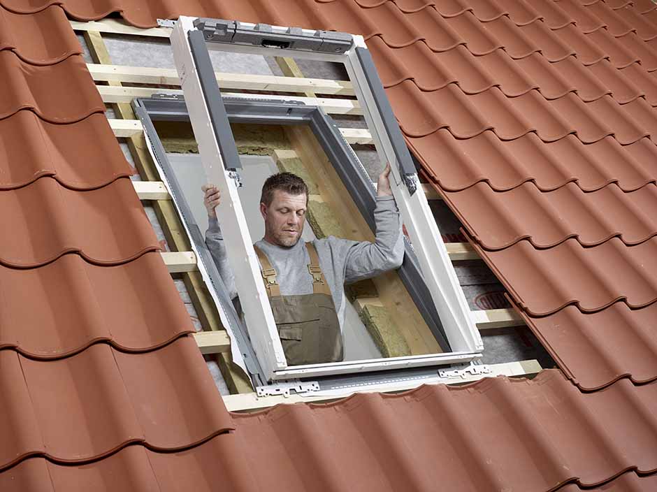 VELUX certified installer installing a roof window