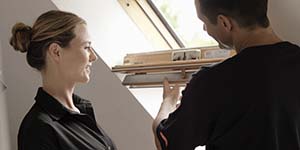 VELUX service technician helping a customer